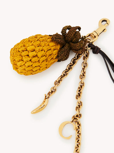 CHLOÉ -Bijou de sac ananas en raphia, métal et cuir
